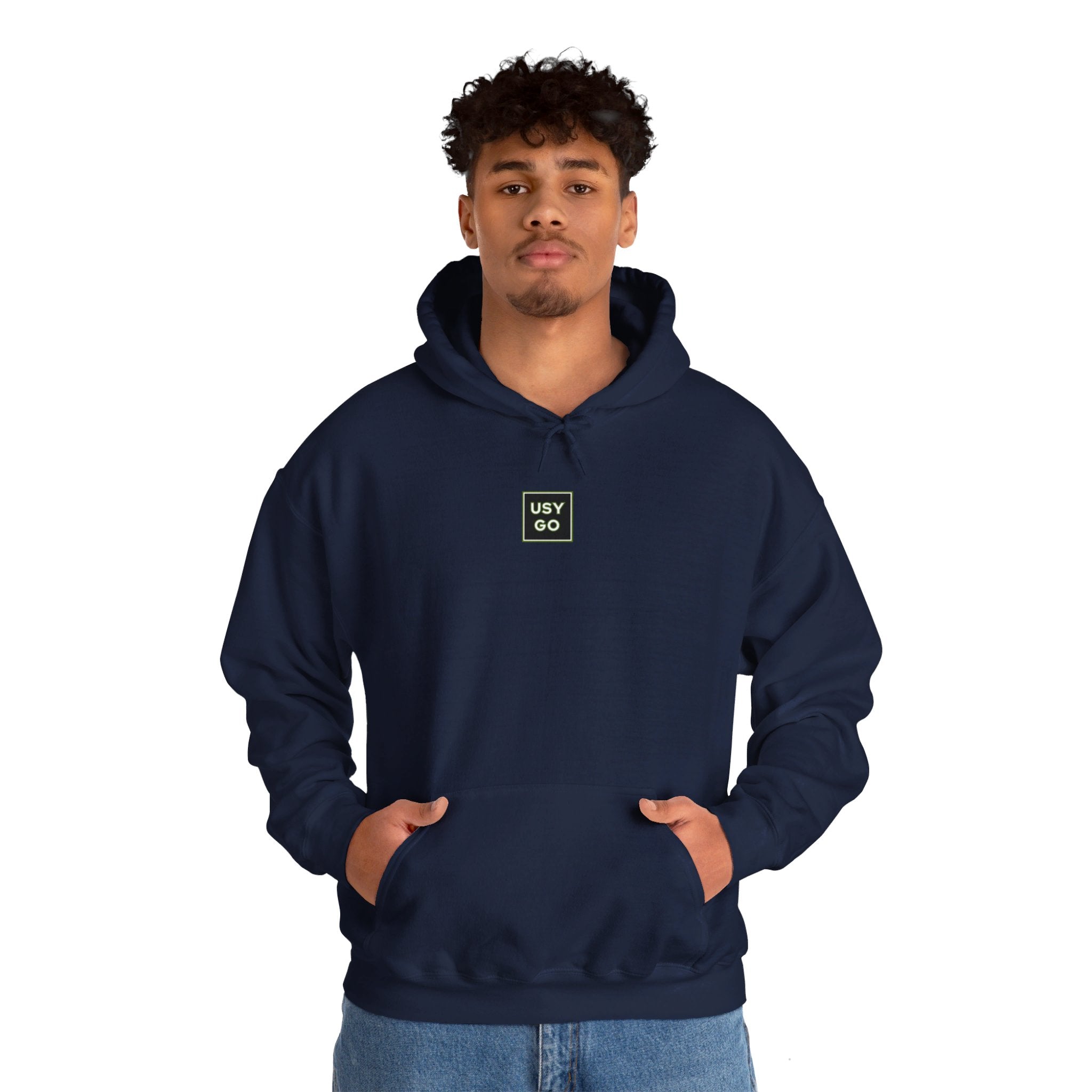 Person wearing a Heavy Blend Hoodie Gildan 18500 Unisex Jersey with USYGO logo on the front. Made from 50% Cotton 50% Polyester in Navy. Pouch pocket and the tear-away label make for a highly comfortable, scratch-free wearing.