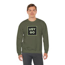 Person wearing a Heavy Blend Crewneck Sweatshirt Gildan 18000 Unisex with USYGO logo on the front. Made from 50% Cotton 50% Polyester in Military Green.