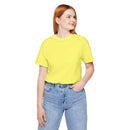 Person wearing Bella+Canvas 3001 Unisex Jersey Short Sleeve Tee with  no design by  on the front. Made from lightweight 100% Airlume combed and ring-spun cotton in Yellow, ideal for active and leisure wear.