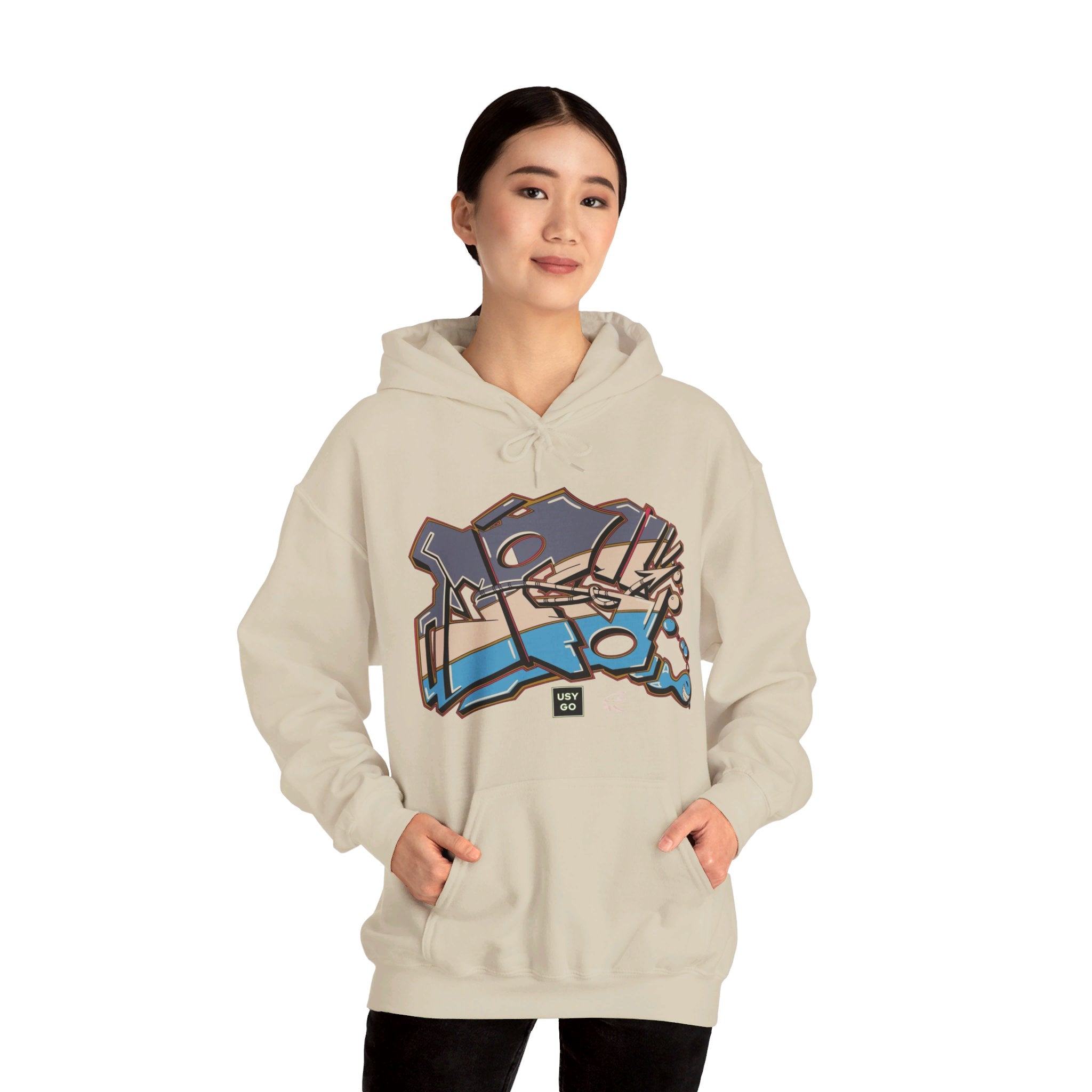 Person wearing a Heavy Blend Hoodie Gildan 18500 Unisex Jersey with JG Fish design by @johnnygraff31 printed on the front. Made from 50% Cotton 50% Polyester in Sand. Pouch pocket and the tear-away label make for a highly comfortable