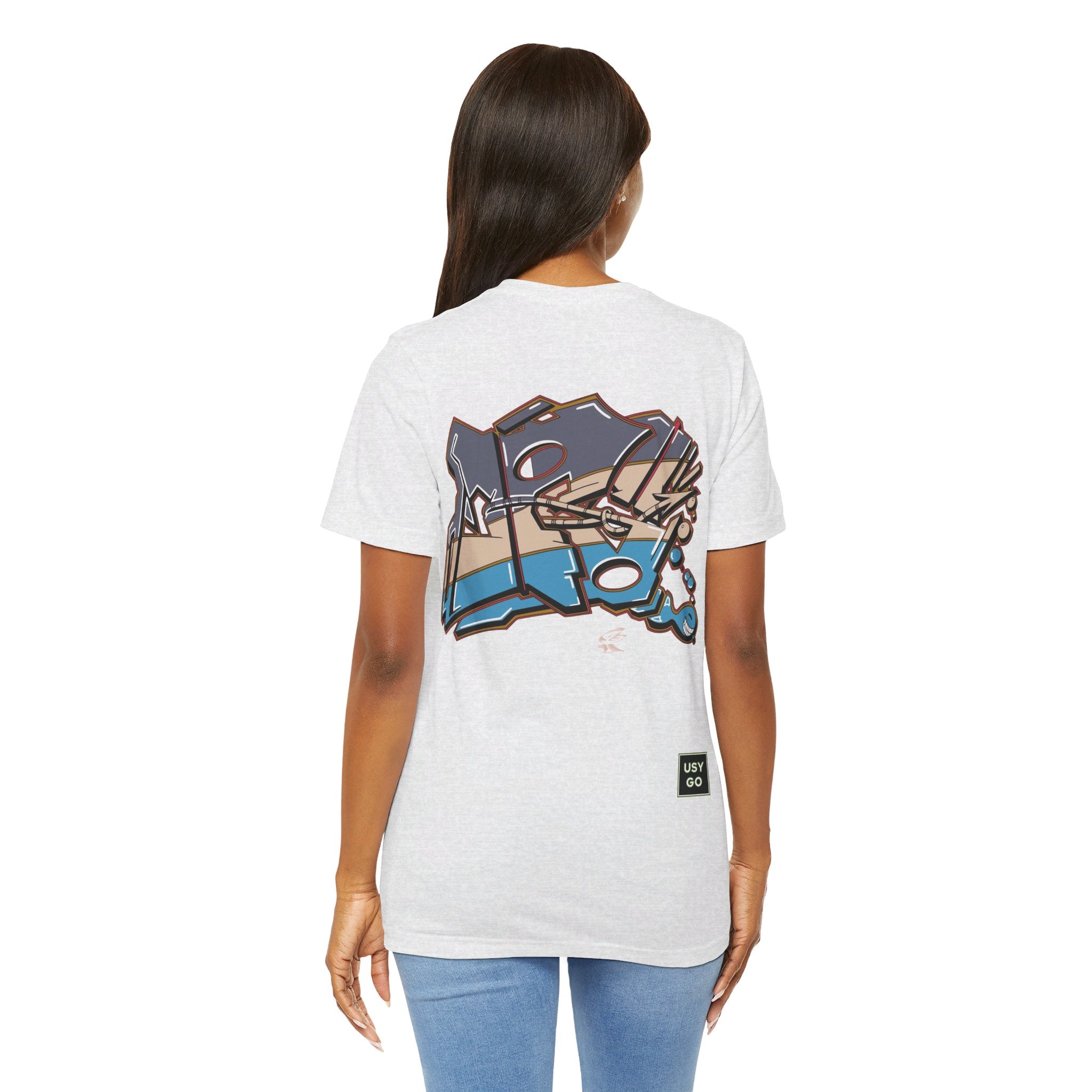 Person wearing Bella+Canvas 3001 Unisex Jersey Short Sleeve Tee with JG Fish Graffiti design on the back. Made from lightweight 100% Airlume combed and ring-spun cotton in Ash, ideal for active and leisure wear