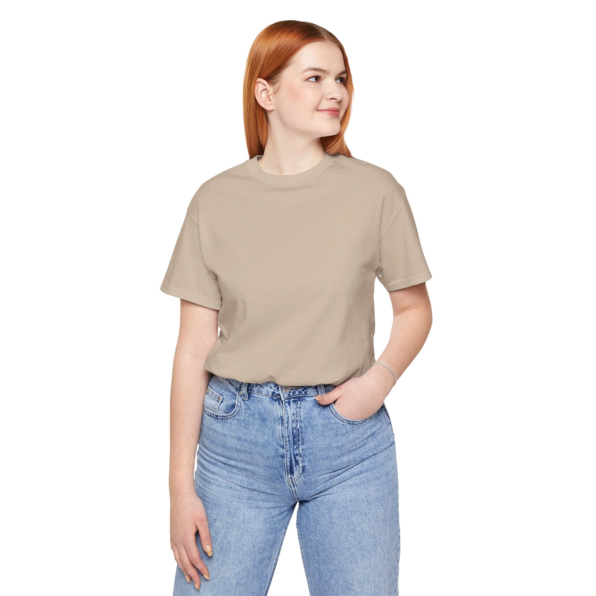 Person wearing Bella+Canvas 3001 Unisex Jersey Short Sleeve Tee with no design on the front. Made from lightweight 100% Airlume combed and ring-spun cotton in Tan, ideal for active and leisure wear.