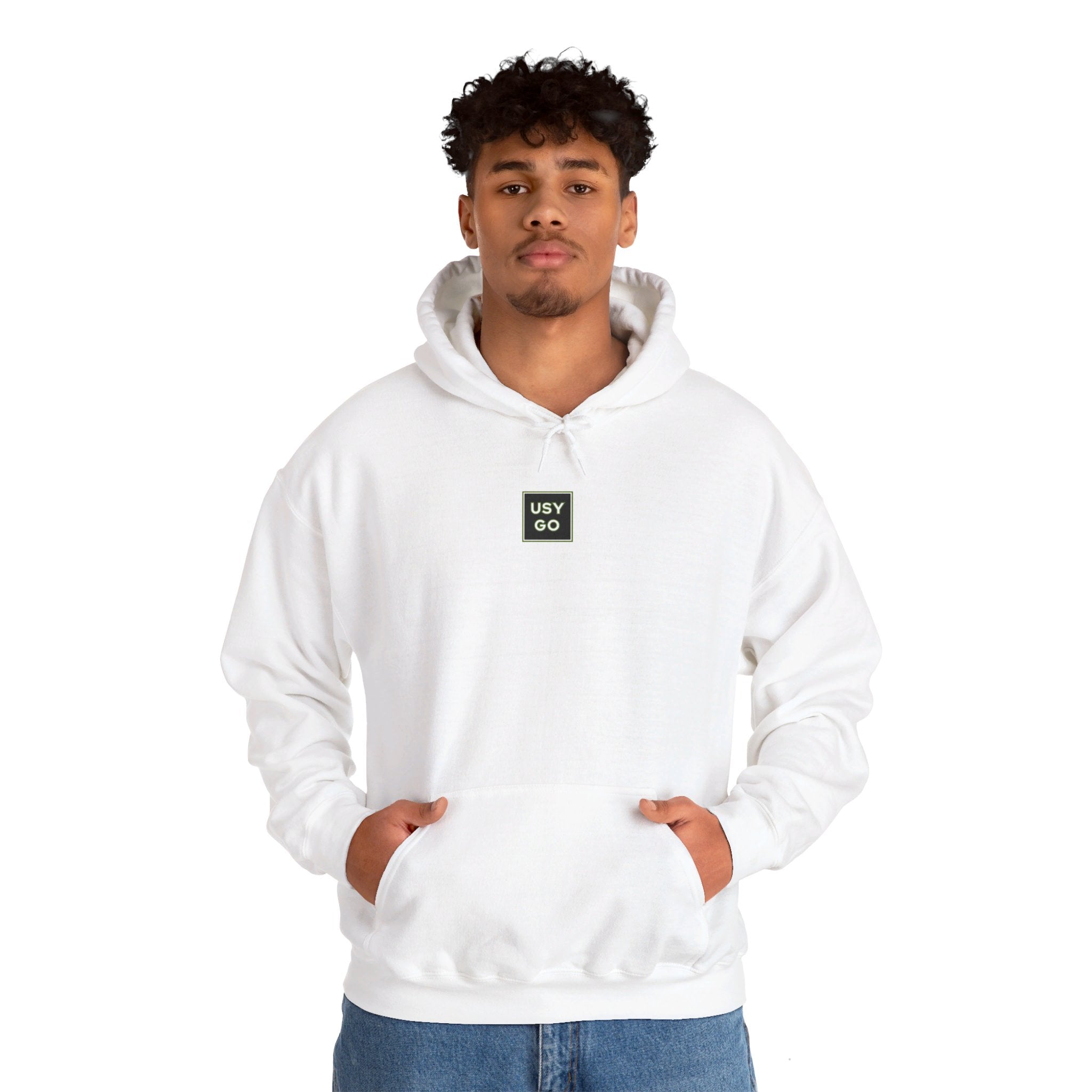 Person wearing a Heavy Blend Hoodie Gildan 18500 Unisex Jersey with USYGO logo on the front. Made from 50% Cotton 50% Polyester in White. Pouch pocket and the tear-away label make for a highly comfortable, scratch-free wearing.