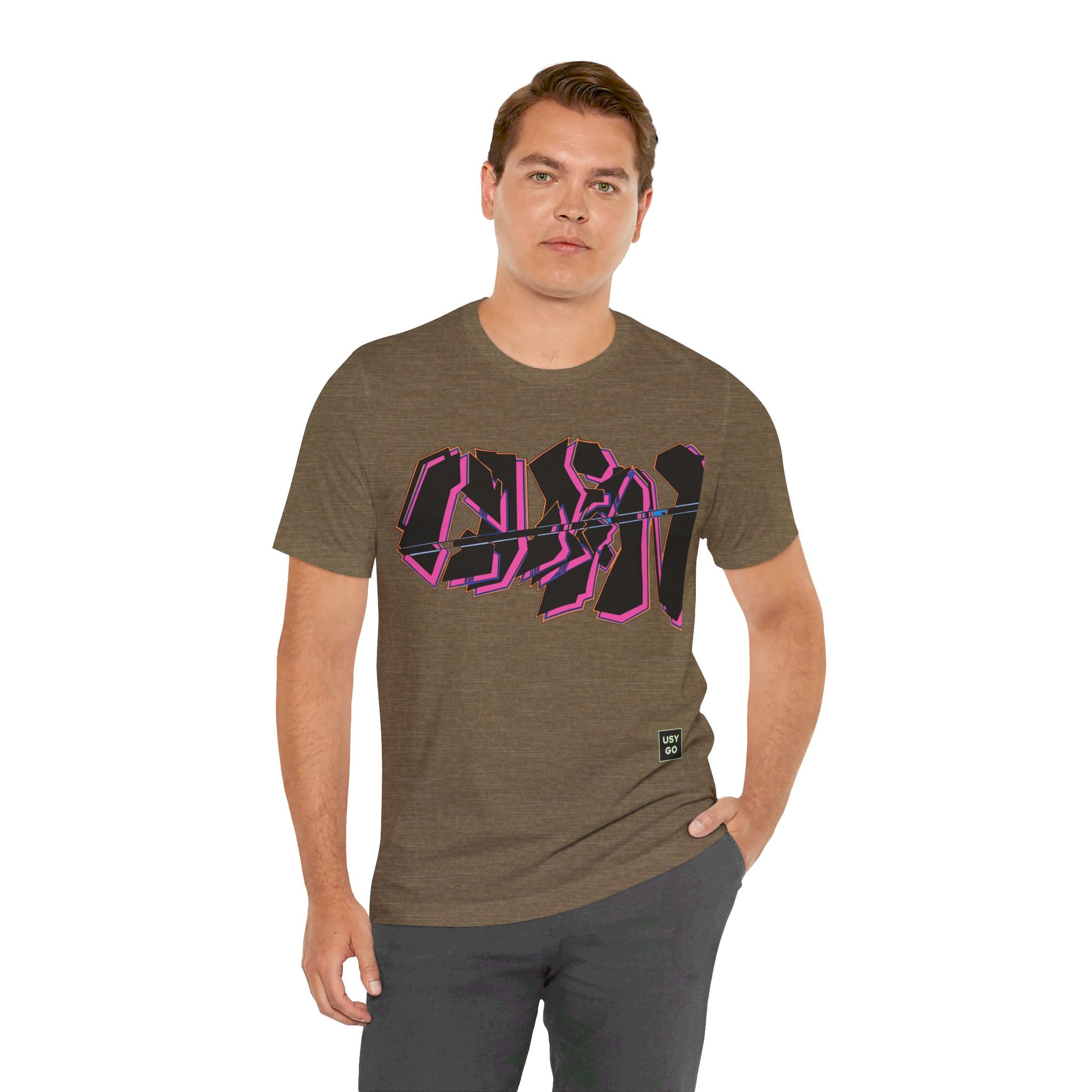 Person wearing Bella+Canvas 3001 Unisex Jersey Short Sleeve Tee with Graffiti Clean design on the front. Design is in Black and Pink. Made from lightweight 100% Airlume combed and ring-spun cotton in Heather Olive, ideal for active and leisure wear.