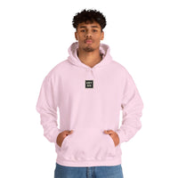 Person wearing a Heavy Blend Hoodie Gildan 18500 Unisex Jersey with USYGO logo on the front. Made from 50% Cotton 50% Polyester in Light Pink. Pouch pocket and the tear-away label make for a highly comfortable, scratch-free wearing.