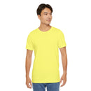 Person wearing a T-Shirt Bella+Canvas 3001 Unisex Jersey Short Sleeve Tee with no design in front. Made from lightweight 100% Airlume combed and ring-spun cotton in Yellow, ideal for active and leisure wear.