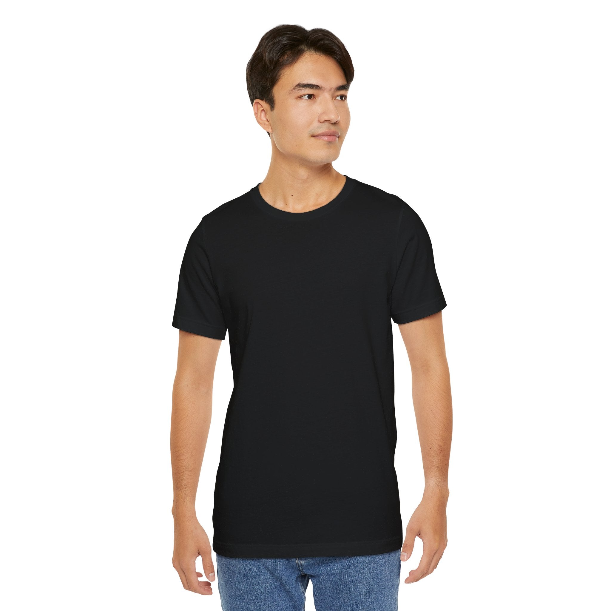 Person wearing a T-Shirt Bella+Canvas 3001 Unisex Jersey Short Sleeve Tee with no design in front. Made from lightweight 100% Airlume combed and ring-spun cotton in Black, ideal for active and leisure wear.