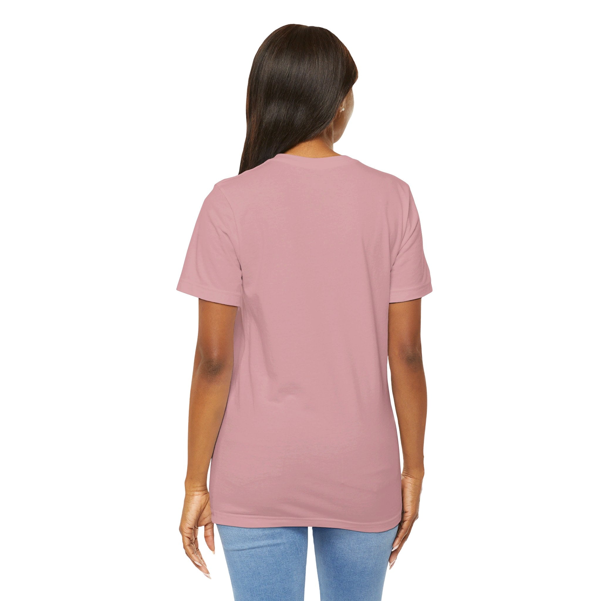 Person wearing Bella+Canvas 3001 Unisex Jersey Short Sleeve Tee with no design on the back. Made from lightweight 100% Airlume combed and ring-spun cotton in Orchid color, ideal for active and leisure wear.