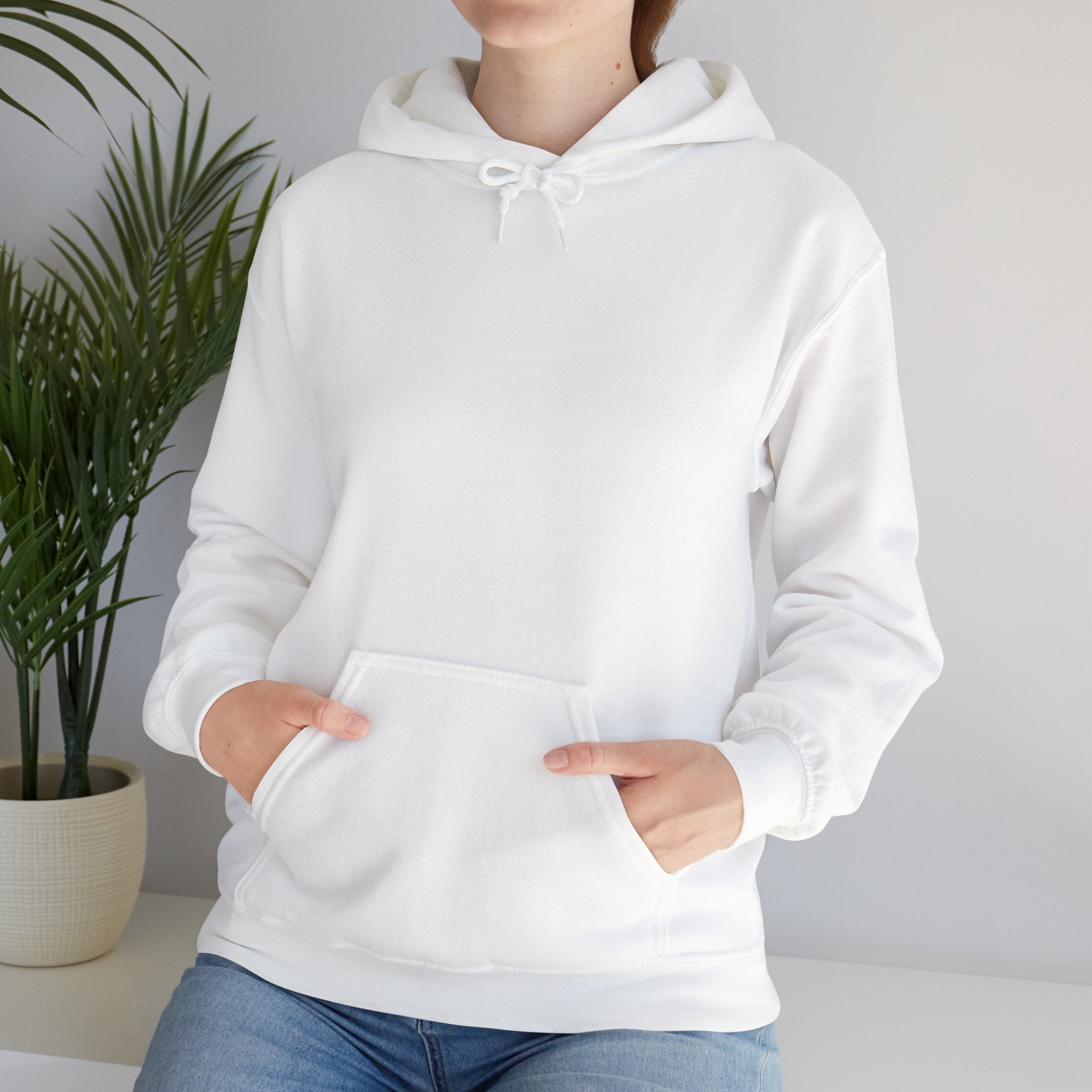 Person wearing a Heavy Blend Hoodie Gildan 18500 Unisex Jersey with blank front. Made from 50% Cotton 50% Polyester in White. Pouch pocket and the tear-away label make for a highly comfortable, scratch-free wearing.