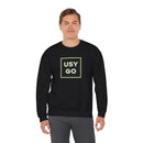 Person wearing a Heavy Blend Crewneck Sweatshirt Gildan 18000 Unisex with USYGO logo on the front. Made from 50% Cotton 50% Polyester in Black.