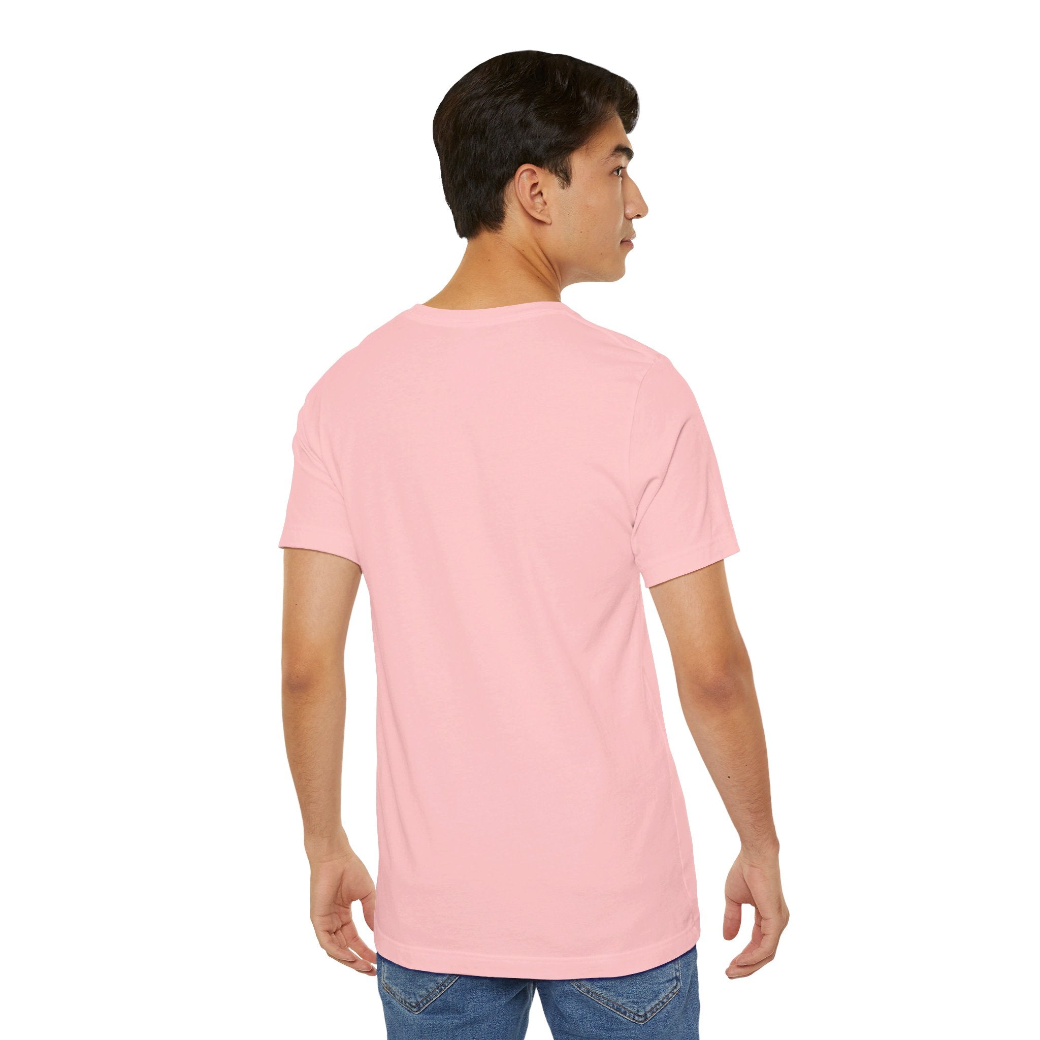 Person wearing a T-Shirt Bella+Canvas 3001 Unisex Jersey Short Sleeve Tee with no design on the back. Made from lightweight 100% Airlume combed and ring-spun cotton in Pink, ideal for active and leisure wear.