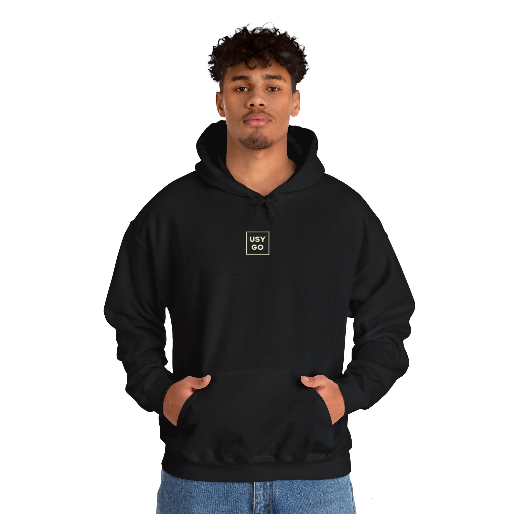 Person wearing a Heavy Blend Hoodie Gildan 18500 Unisex Jersey with USYGO logo on the front. Made from 50% Cotton 50% Polyester in Black. Pouch pocket and the tear-away label make for a highly comfortable, scratch-free wearing.