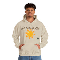 Person wearing a Heavy Blend Hoodie Gildan 18500 Unisex Jersey with Heel to the O SUN design printed on the front. Made from 50% Cotton 50% Polyester in Sand. Pouch pocket and the tear-away label make for a highly comfortable