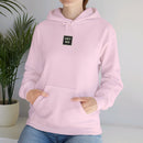 Person wearing a Heavy Blend Hoodie Gildan 18500 Unisex Jersey with USYGO logo on the front. Made from 50% Cotton 50% Polyester in Light Pink. Pouch pocket and the tear-away label make for a highly comfortable, scratch-free wearing.