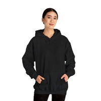 Person wearing a Heavy Blend Hoodie Gildan 18500 Unisex Jersey with blank front. Made from 50% Cotton 50% Polyester in Black. Pouch pocket and the tear-away label make for a highly comfortable, scratch-free wearing.